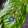 Arete de flor chapados en oro 18k