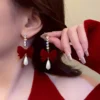 Pendientes de terciopelo con lazo rojo vino